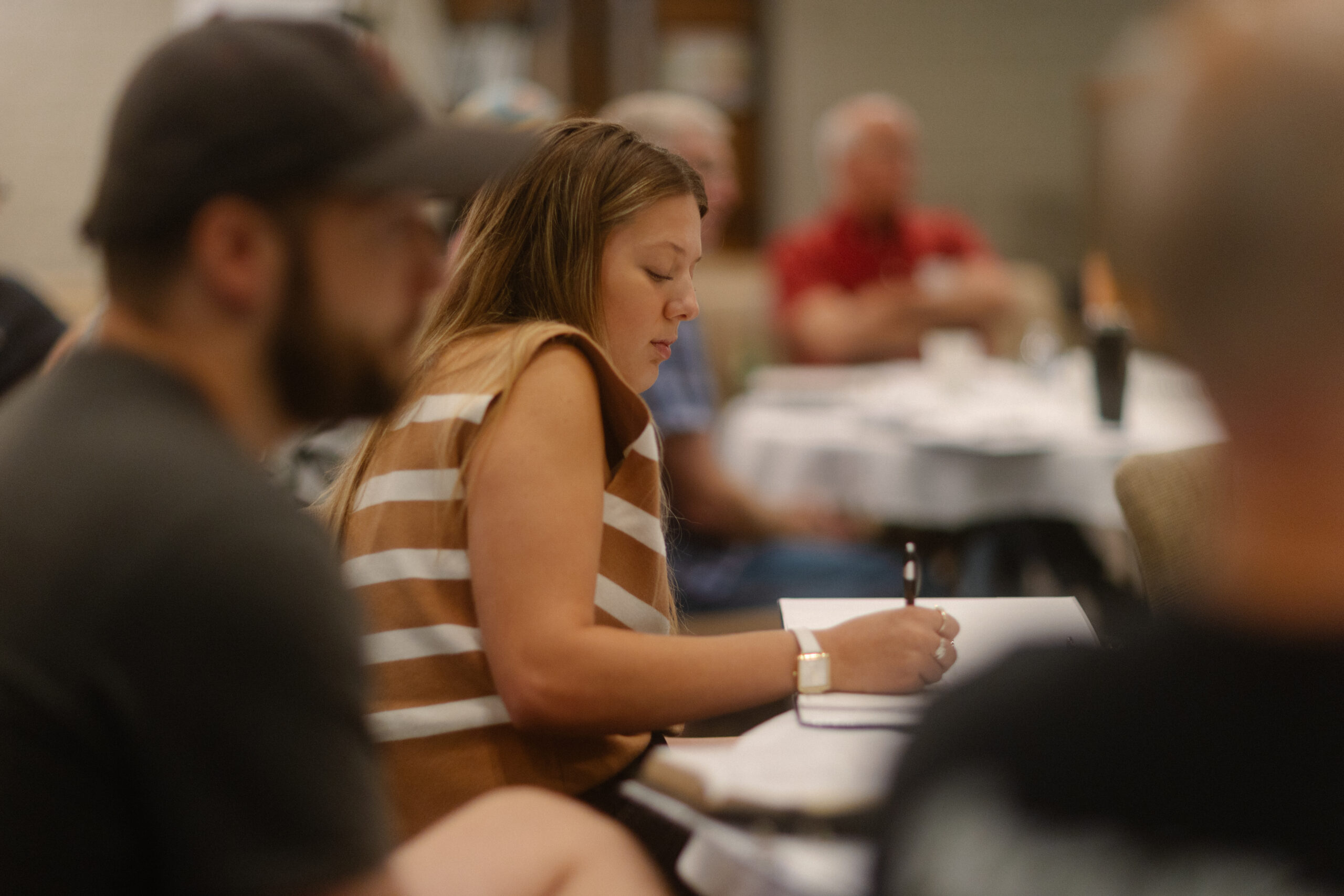 Learner taking notes during leadership training